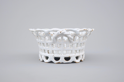 A white monochrome Brussels faience open-worked basket on stand, 18th C.