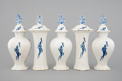 A 5-piece blue and white Dutch Delft garniture with architectural design, 18th C.