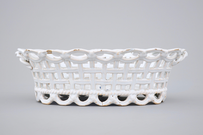 A white monochrome Brussels faience open-worked basket on stand, 18th C.