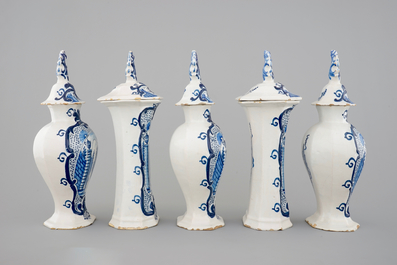 A 5-piece blue and white Dutch Delft garniture with architectural design, 18th C.