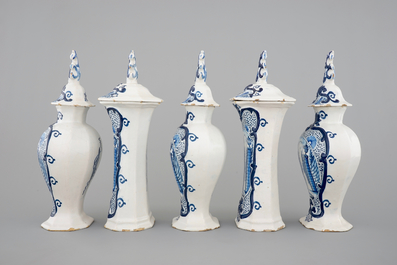 A 5-piece blue and white Dutch Delft garniture with architectural design, 18th C.
