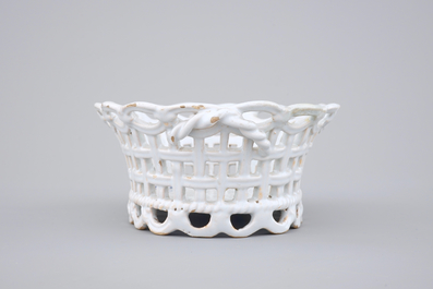 A white monochrome Brussels faience open-worked basket on stand, 18th C.