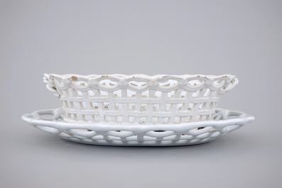 A white monochrome Brussels faience open-worked basket on stand, 18th C.