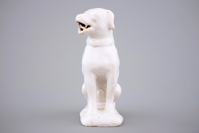 A white monochrome Dutch Delft figure of a dog, 18th C.