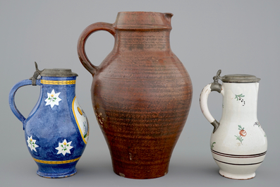A pewter-mounted Brussels faience jug, a large Raeren jug and a Northern-French jug, 18/19th C.