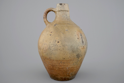 A tall stoneware bellarmine face jug, 17/18th C.