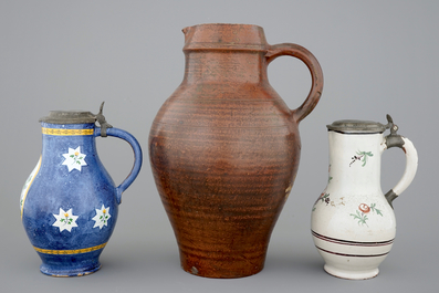 A pewter-mounted Brussels faience jug, a large Raeren jug and a Northern-French jug, 18/19th C.