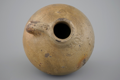 A tall stoneware bellarmine face jug, 17/18th C.