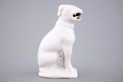 A white monochrome Dutch Delft figure of a dog, 18th C.
