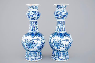 A pair of blue and white Dutch Delft vases with peacocks, ca. 1700