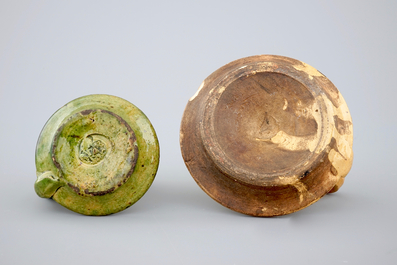 Two medieval tiles and two late medieval candlesticks, 16/17th C.