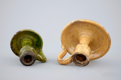 Two medieval tiles and two late medieval candlesticks, 16/17th C.