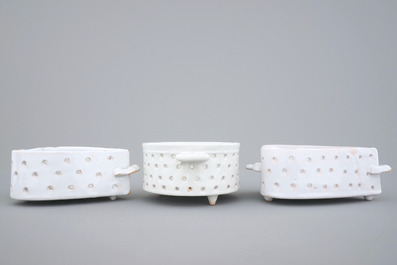 Three white Dutch Delft strainers, round and heart-shaped, 18th C.