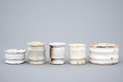 A set of five monochrome white Dutch Delft ointment jars, 17th C.