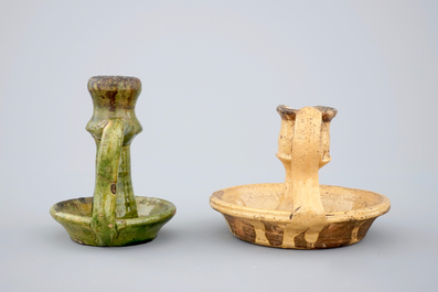 Two medieval tiles and two late medieval candlesticks, 16/17th C.