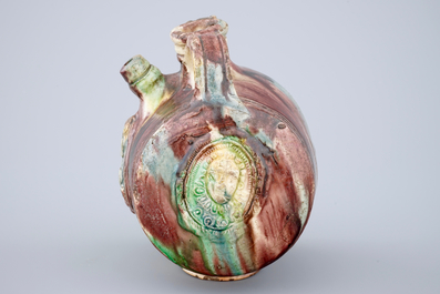 A polychrome glazed pottery barrel-shaped jug, Saintonge, France, 17th C.