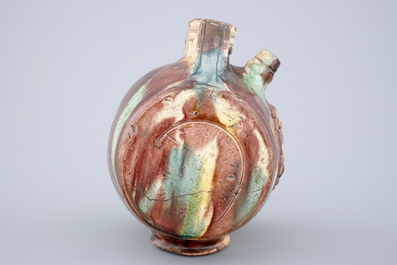 A polychrome glazed pottery barrel-shaped jug, Saintonge, France, 17th C.