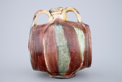 A polychrome glazed pottery barrel-shaped jug, Saintonge, France, 17th C.