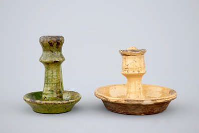 Two medieval tiles and two late medieval candlesticks, 16/17th C.