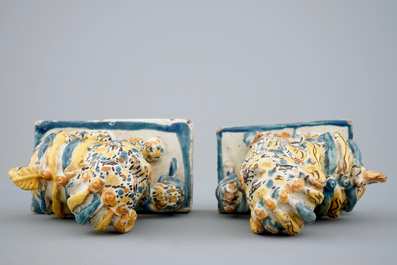 A pair of polychrome Spanish Talavera pottery lions, 18th C.