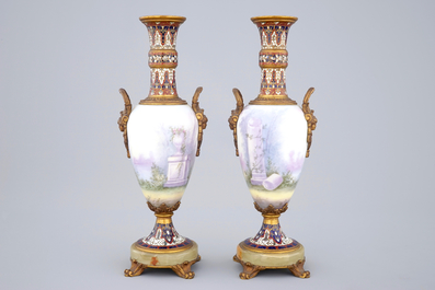 Une paire de vases en porcelaine de S&egrave;vres mont&eacute; en bronze et email champlev&eacute;, 19&egrave;me