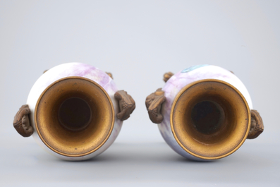 Une paire de vases en porcelaine de S&egrave;vres mont&eacute; en bronze et email champlev&eacute;, 19&egrave;me