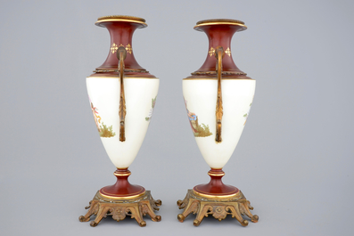 A pair of S&egrave;vres style vases with bronze mounts, Brussels, 19th C.