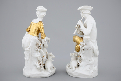 A pair of white and gilt Capodimonte porcelain figures of musicians, 19th C.