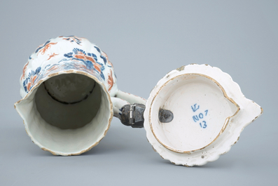 A polychrome Dutch Delft jug with cover, 18th C.