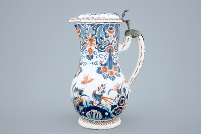 A polychrome Dutch Delft jug with cover, 18th C.