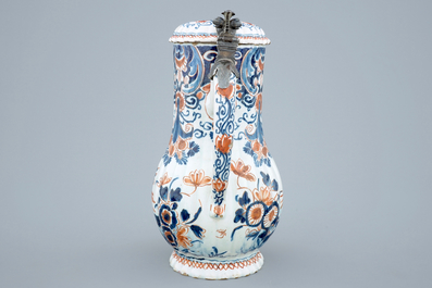 A polychrome Dutch Delft jug with cover, 18th C.