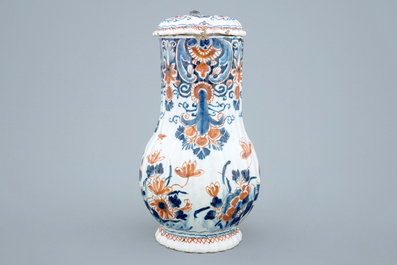 A polychrome Dutch Delft jug with cover, 18th C.