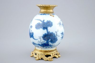 A Dutch Delft blue and white chinoiserie vase with bronze mounts, 17th C.