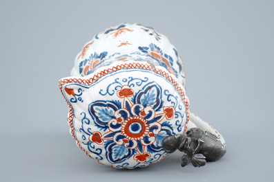 A polychrome Dutch Delft jug with cover, 18th C.