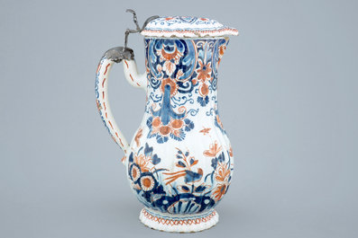 A polychrome Dutch Delft jug with cover, 18th C.