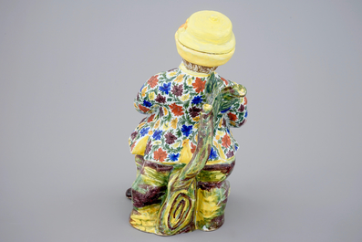 A polychrome Dutch Delft table fountain in the shape of a man, 18th C.
