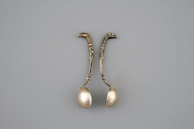 Two silver salts modelled as swans, with spoons