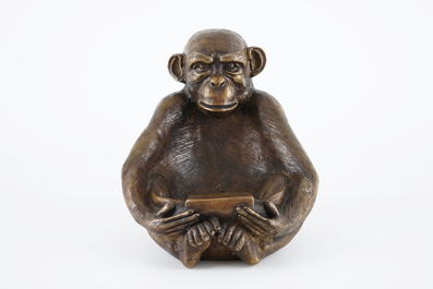 A bronze sculpture of a monkey holding a tray, 20th C.