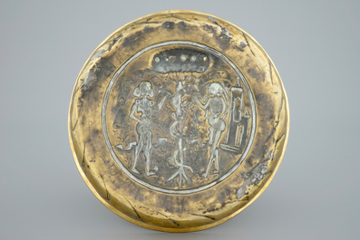 A Nuremberg brass alms bowl depicting Adam and Eve, 15/16th C.