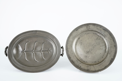 A large collection of pewter, incl. jugs and dishes, and two brass shakers, 17/19th C.