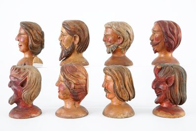 A set of eight painted wooden doll heads, 19th C.