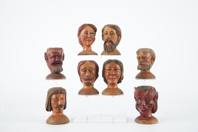 A set of eight painted wooden doll heads, 19th C.