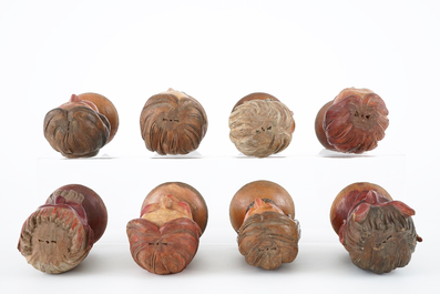 A set of eight painted wooden doll heads, 19th C.