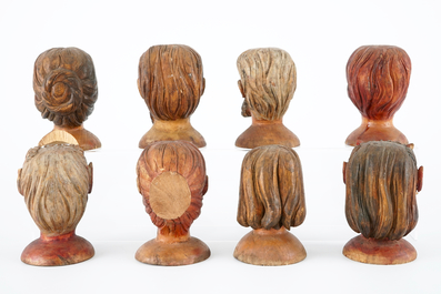 A set of eight painted wooden doll heads, 19th C.