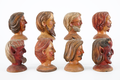 A set of eight painted wooden doll heads, 19th C.