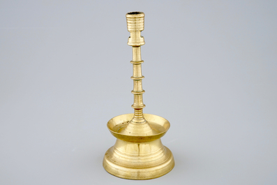 A copper alloy candle stick, The Low Countries, late 15th C.
