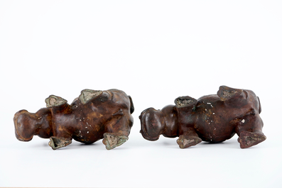 A group of bronze and regule animals: a group of cats, two hippos and a crane, 20th C.