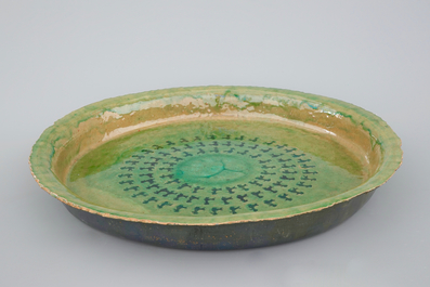 Jack Jefferys (1896-1961): A large decorated green glazed ceramic dish
