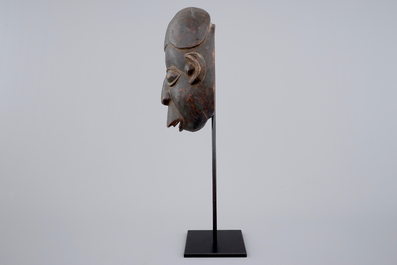 An African carved wooden mask, Bamum, Cameroon