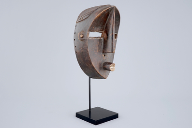 An African carved wooden mask, Lwalwa, Congo, early 20th C.